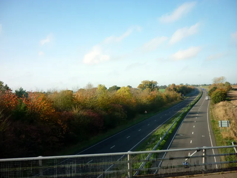 Looking west along the A47 at Acle. The photograph does not show any of the sites in the register.
