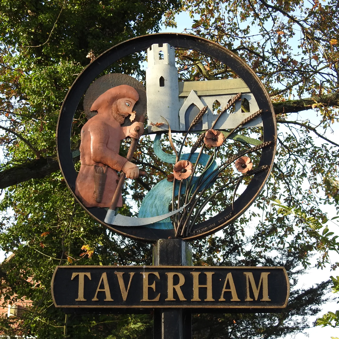 The village sign at Taverham, where two self-build homes on Taverham Road are the longest-running of the three applications going before the committee.